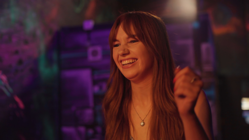 A woman playing arcade games.
