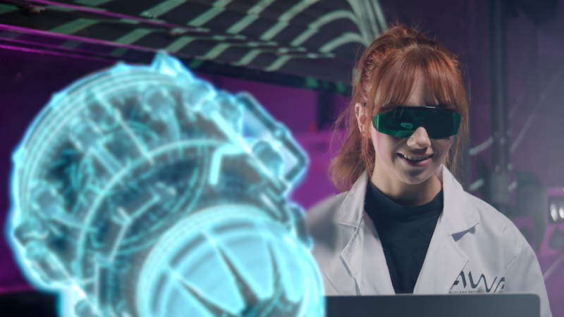 A woman in a white lab coat with the "AWE" logo sits at a computer, viewing a holographic projection of an engine.
