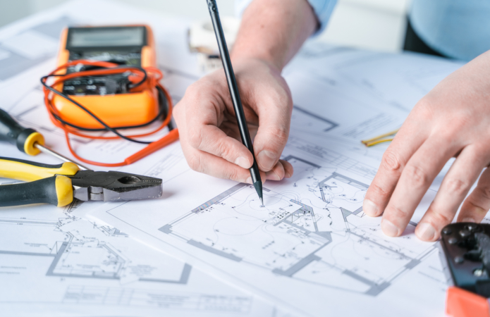 Man repairer making electricity project in house.